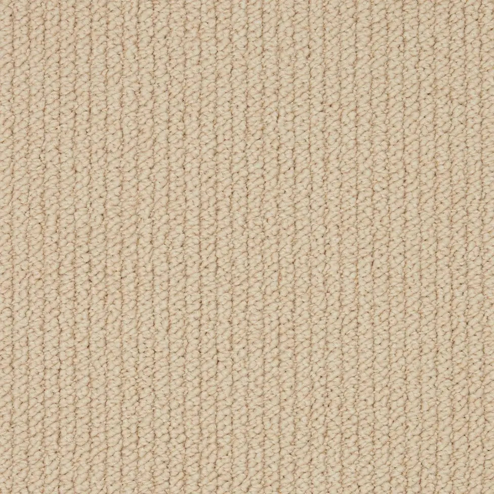 Beige loop pile carpet texture, close-up of woven flooring surface