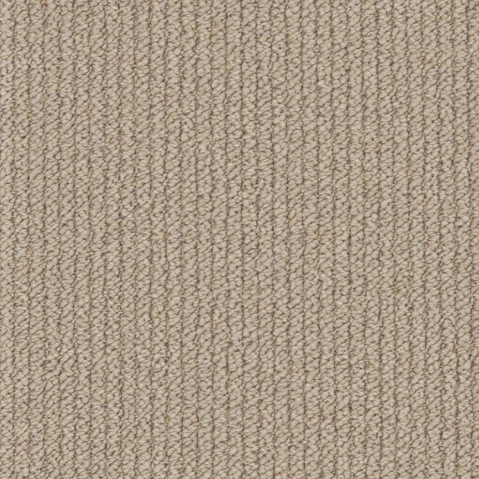 Beige textured loop pile carpet flooring with a subtle pattern, perfect for home interiors