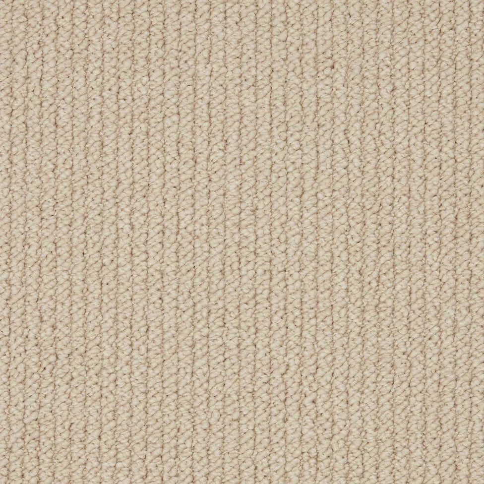 Beige loop pile carpet texture, close-up of woven flooring material