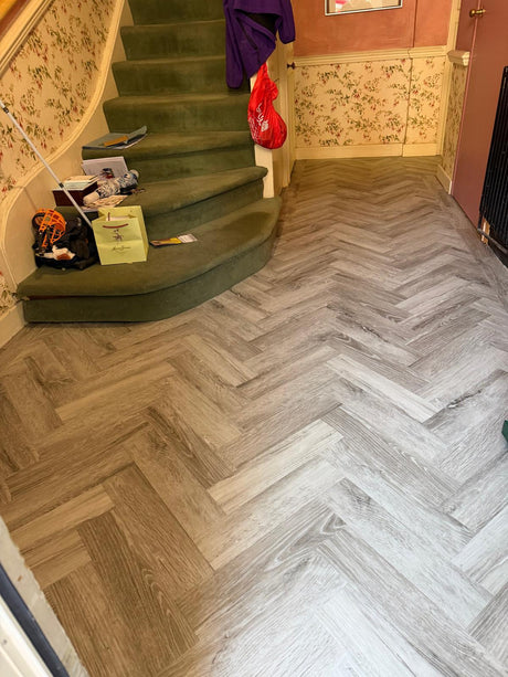 Amtico herringbone LVT flooring with a perimeter border installed in Barons Court, Hammersmith, London