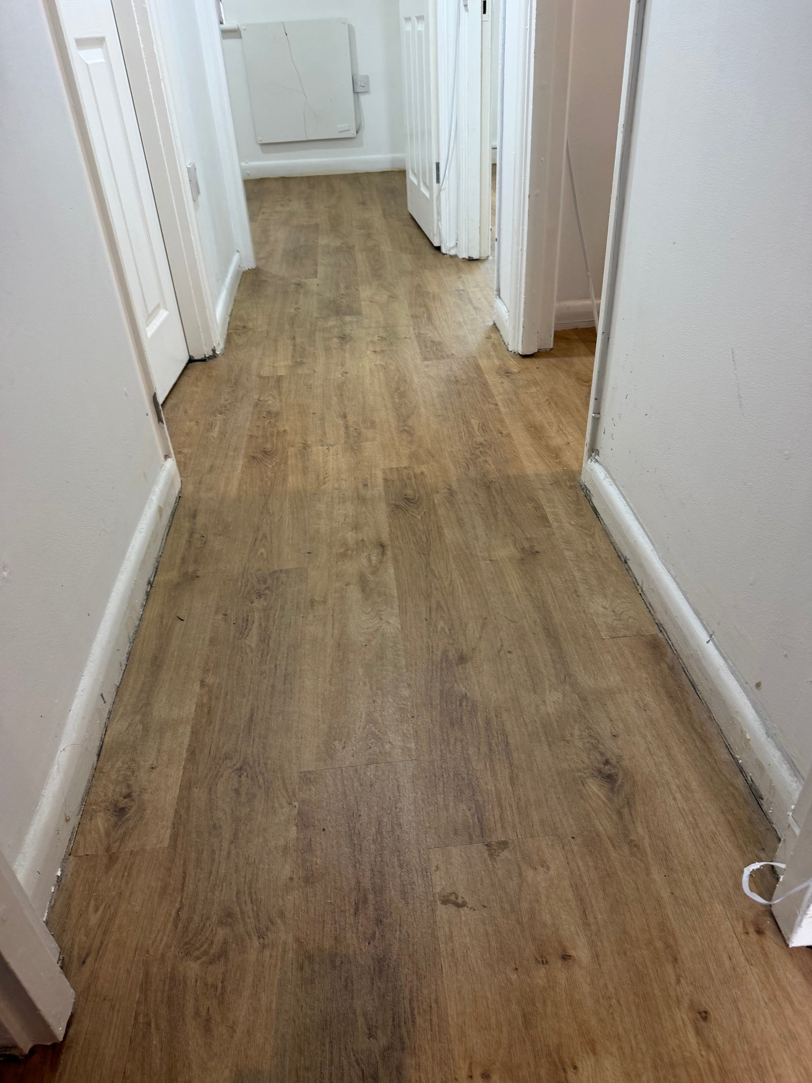 Completed Luxury Vinyl Tile flooring installation in the living room of a Guildford apartment using Polyflor Expona 6500 by EXEN Flooring.